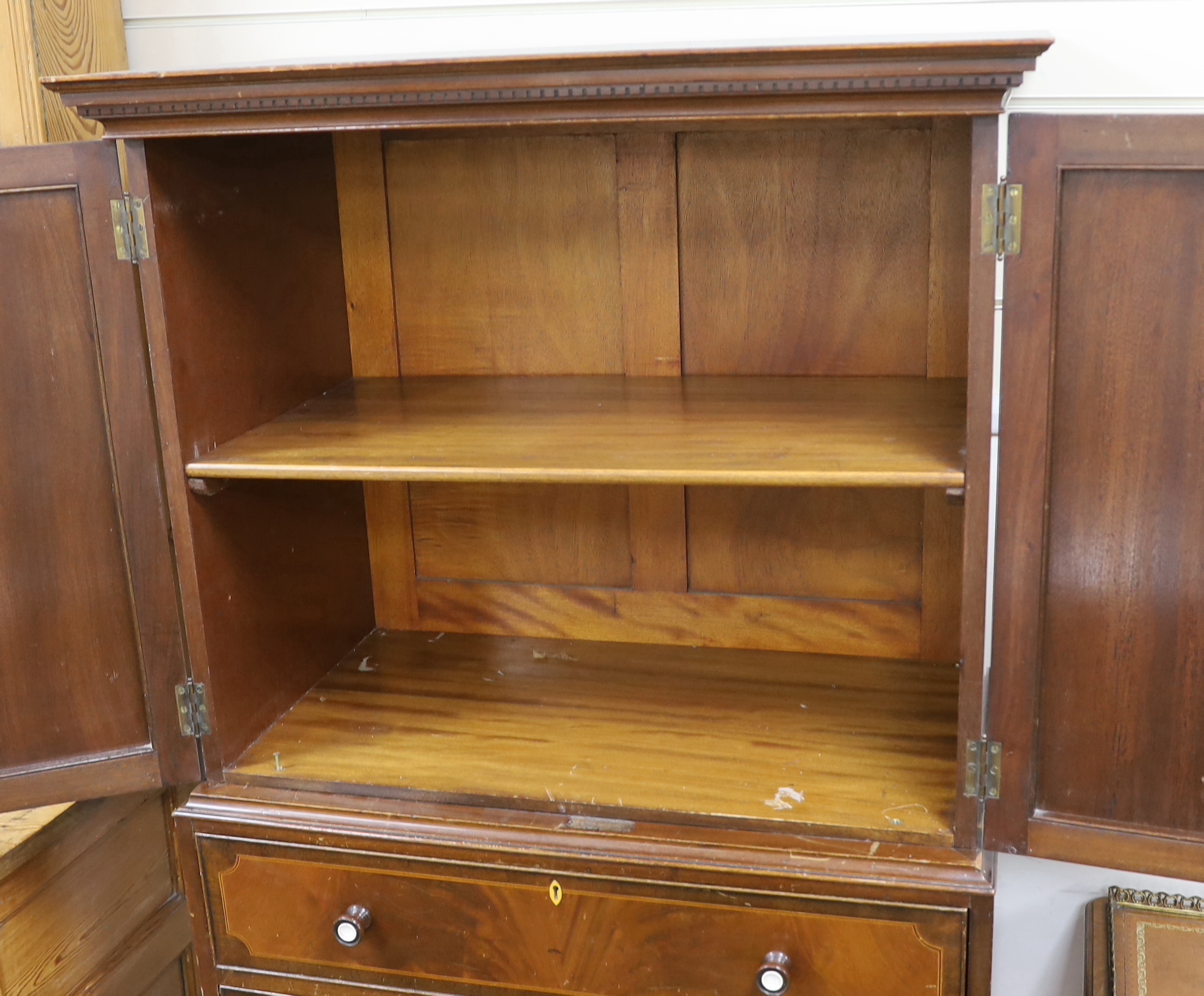 An early 20th century Maple & Co. mahogany narrow press cupboard, width 80cm, depth 45cm, height 168cm
